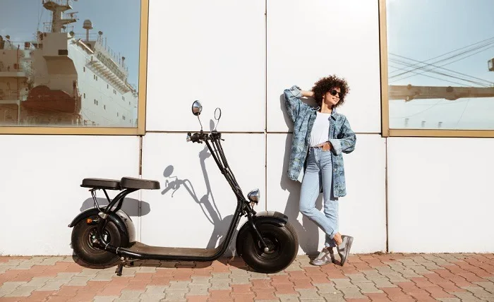 Why You Should Consider an Electric Trike Bike stylish pretty woman sunglasses posing 2