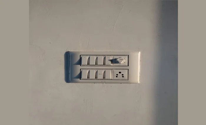 Everything You Need to Know About AC and DC Isolator Switches Isolator switches and a fan knob attached on a wall