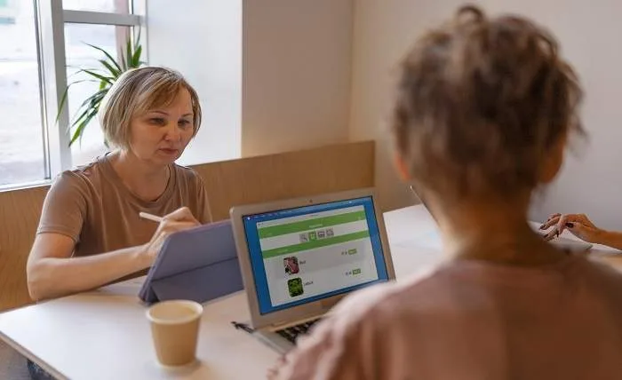 Online Counselling Explained: Steps, Benefits, and Choosing the Right Service senior woman working spending time with friends 23 2149260274